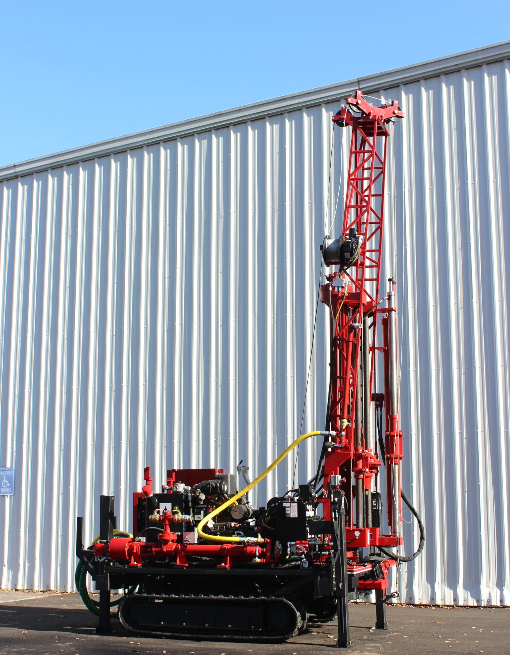 D26 Diedrich Drill track-mounted rig with vertical mast set up outdoors, used for soil testing and geotechnical drilling operations.