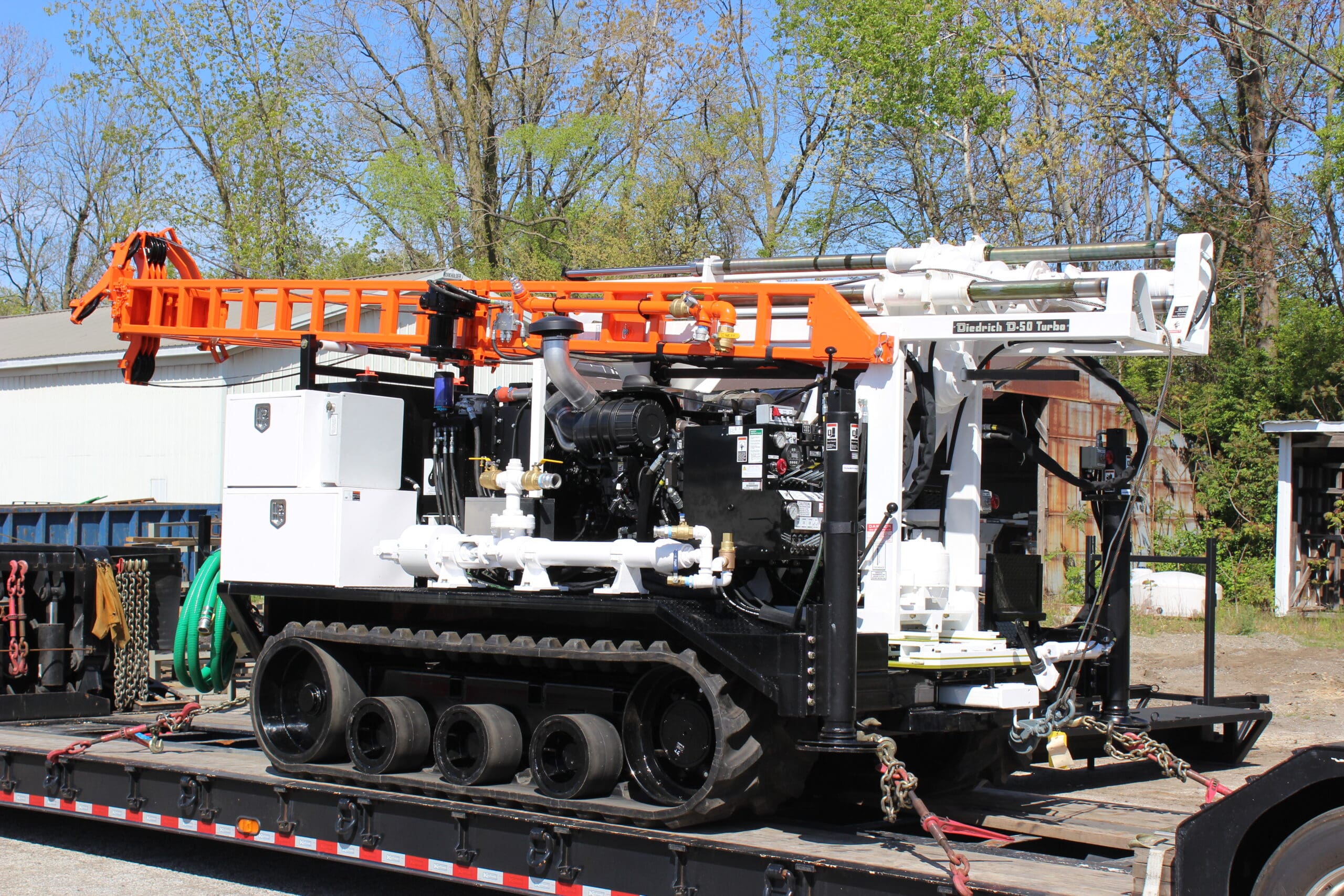 Diedrich D50 Turbo track-mounted drill rig on trailer, featuring powerful mechanical drilling system for geotechnical and environmental drilling.